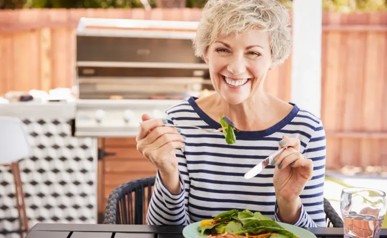 Happy woman enjoying a delicious healthy meal